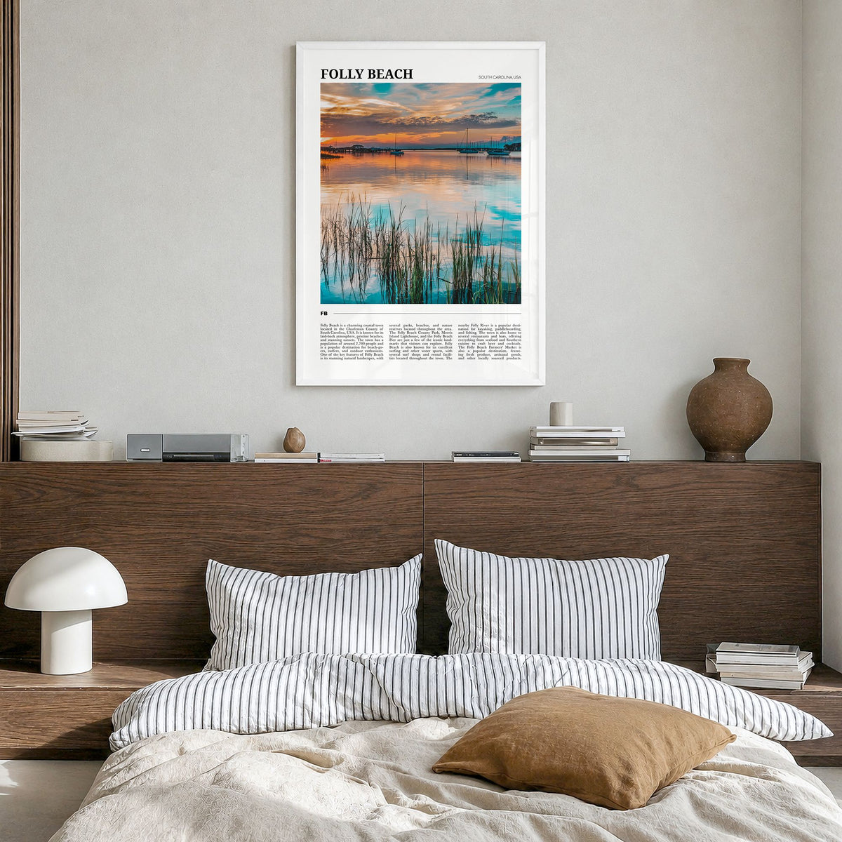 Folly Beach Travel Poster in a white wood frame, hanging in a bedroom