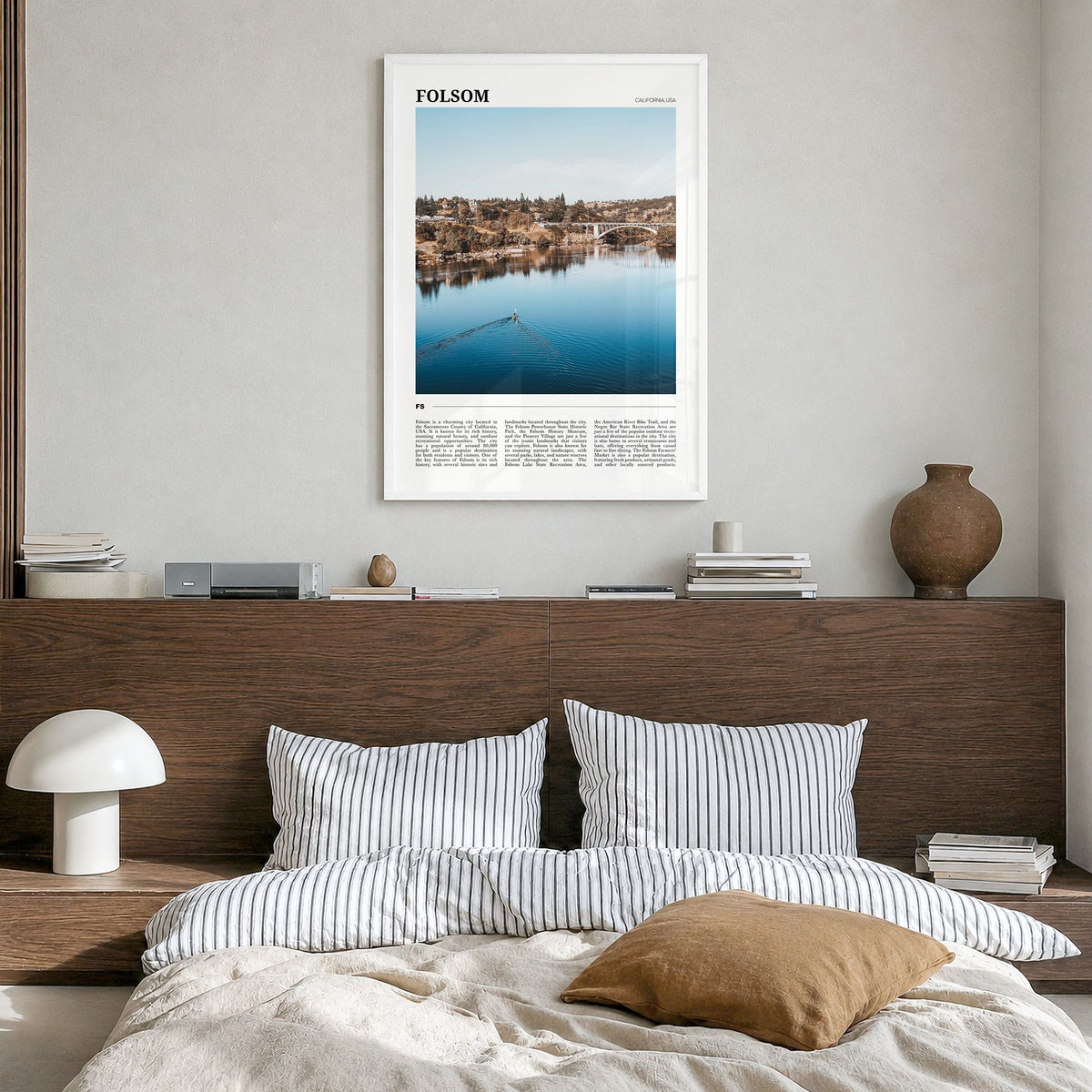 Folsom Travel Poster in a white wood frame, hanging in a bedroom