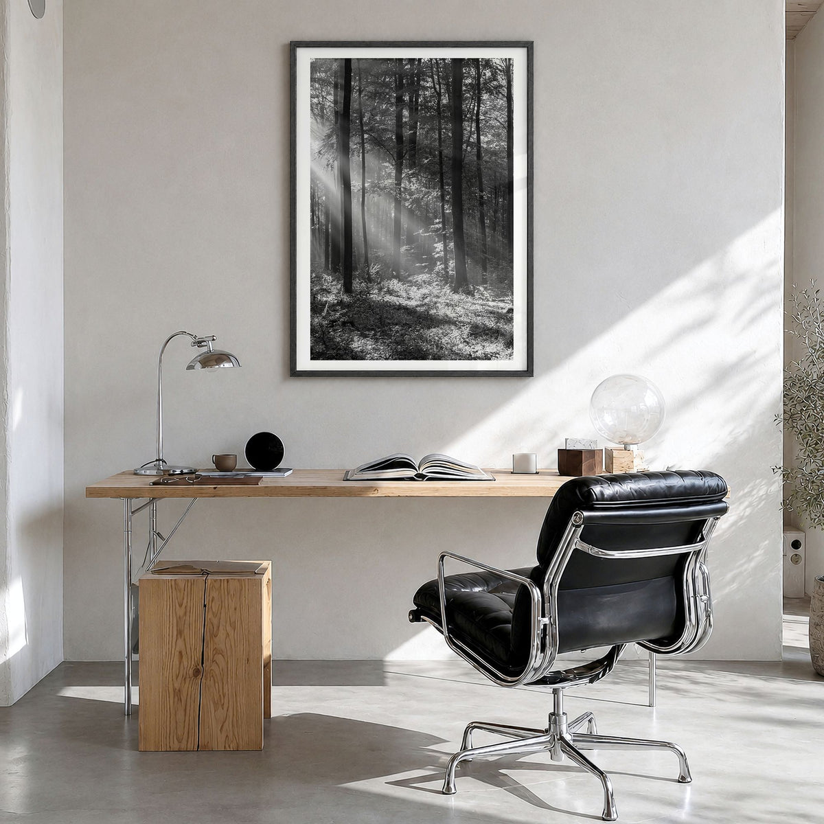 Forest Photo Poster in a black wood frame, hanging in a bright home office, white border
