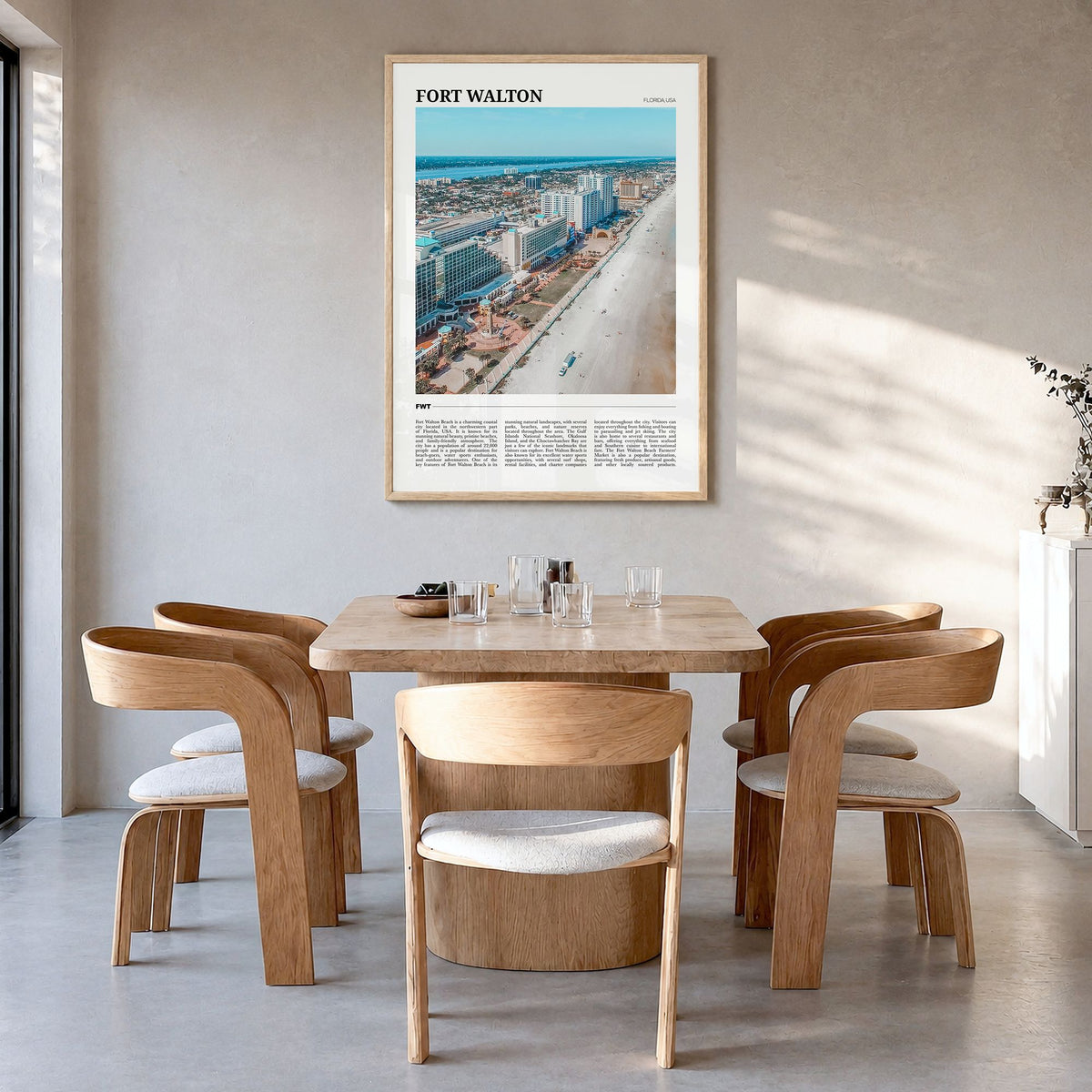 Fort Walton Travel Poster in a natural wood frame, hanging in a dining room