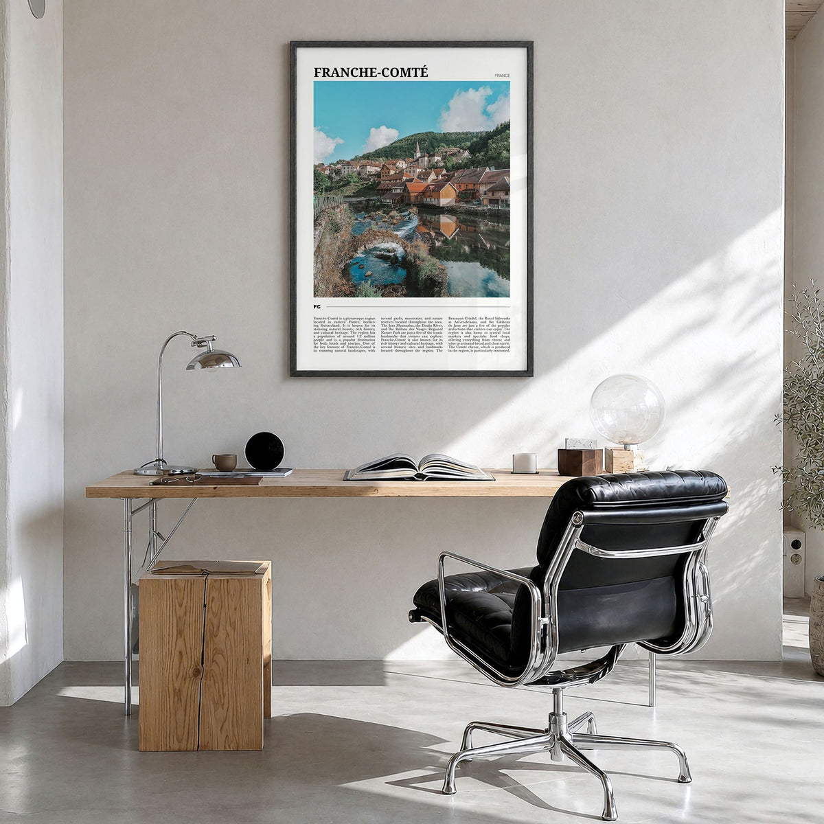 Franche-Comté Travel Poster in a black wood frame, hanging in a bright home office