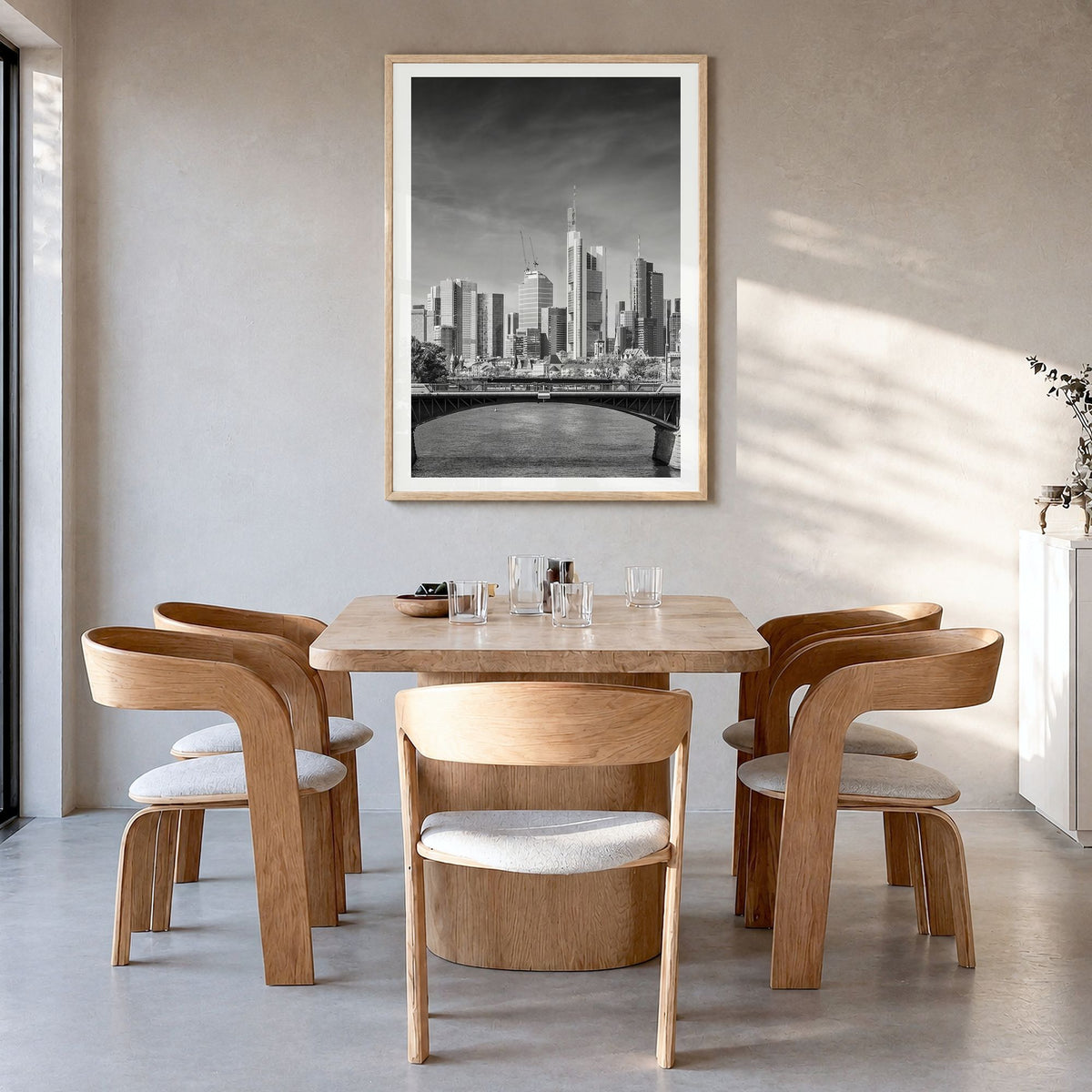 Frankfurt am Main Photo Poster in a natural wood frame, hanging in a dining room, white border