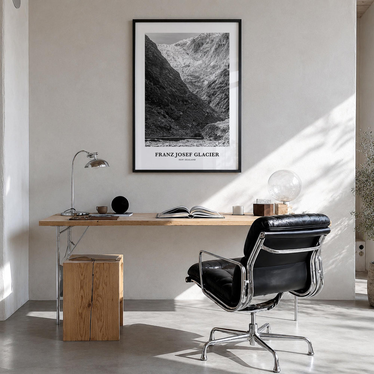 Franz Josef Glacier black & white classic poster of New Zealand – vertical wall art in black wood frame, hanging on wall