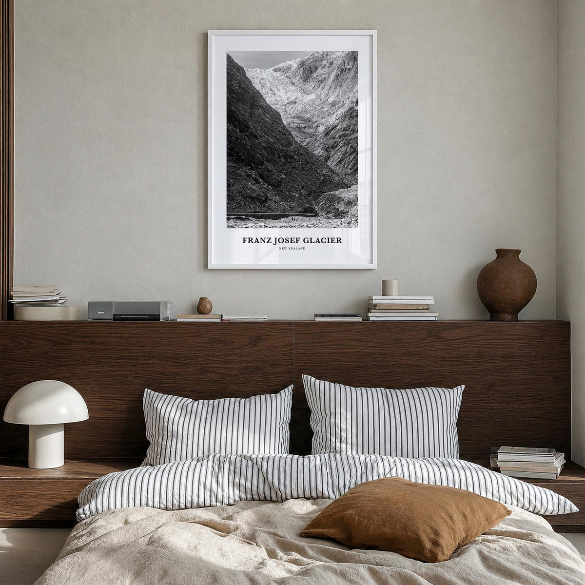 Franz Josef Glacier black & white classic poster of New Zealand – vertical wall art in white wood frame, hanging on wall