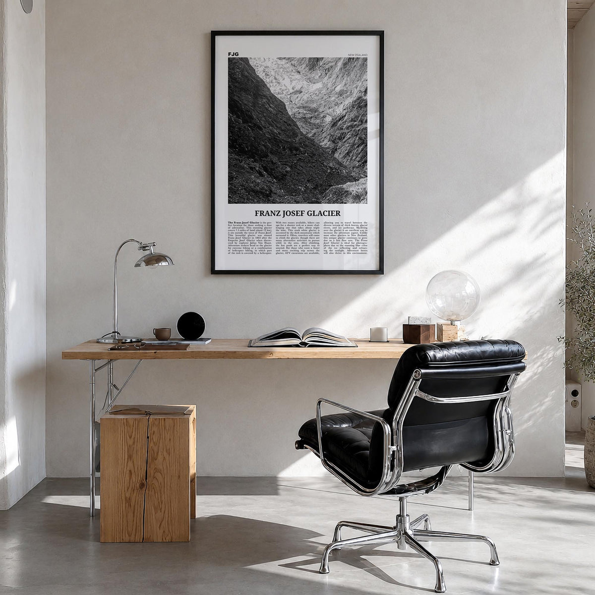 Franz Josef Glacier black & white newspaper poster of New Zealand – vertical wall art in black wood frame, hanging on wall