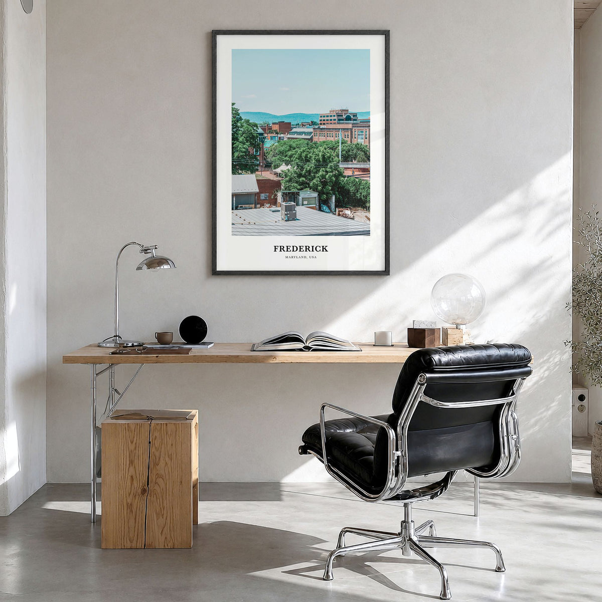 Frederick Classic Poster in a black wood frame, hanging in a bright home office