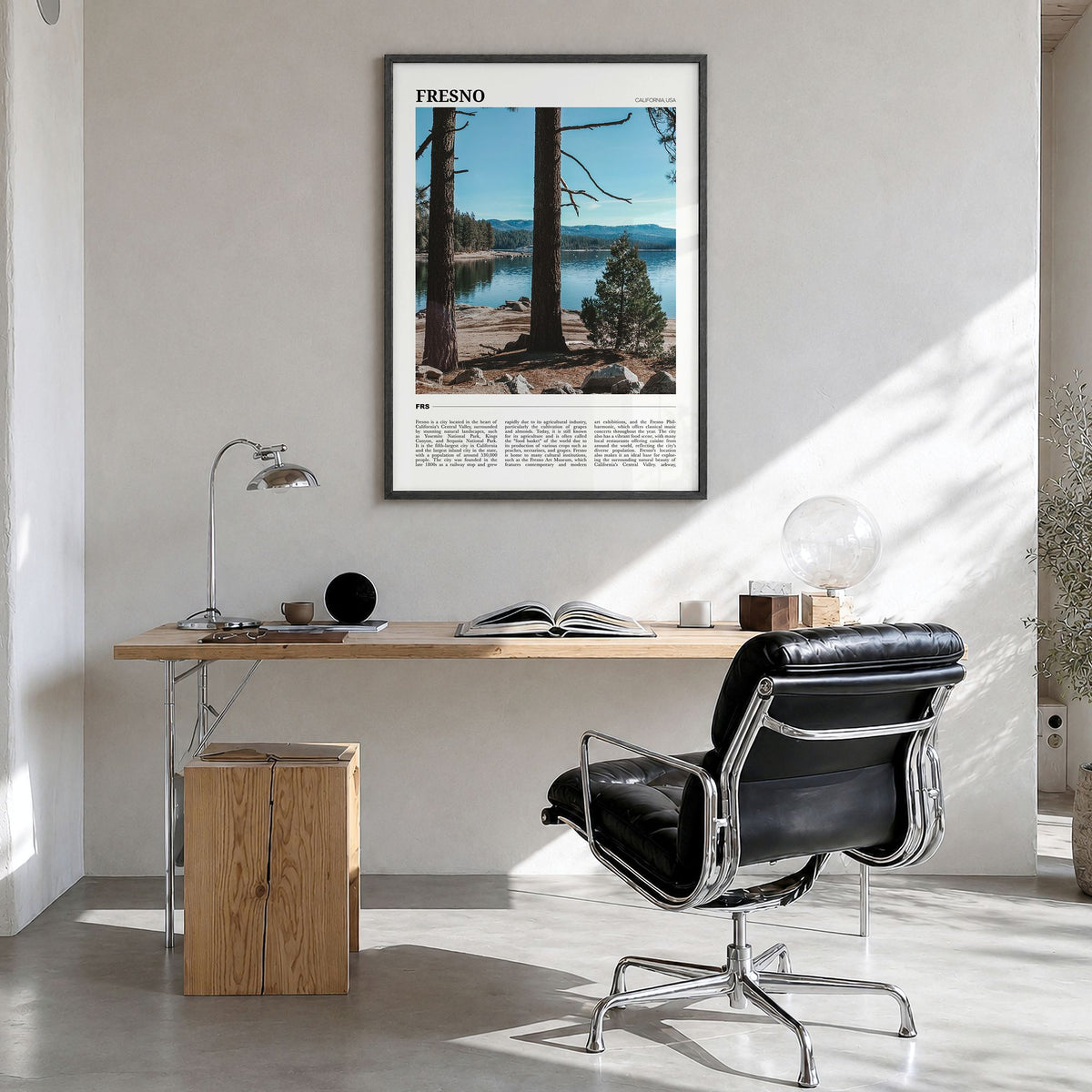 Fresno Travel Poster in a black wood frame, hanging in a bright home office