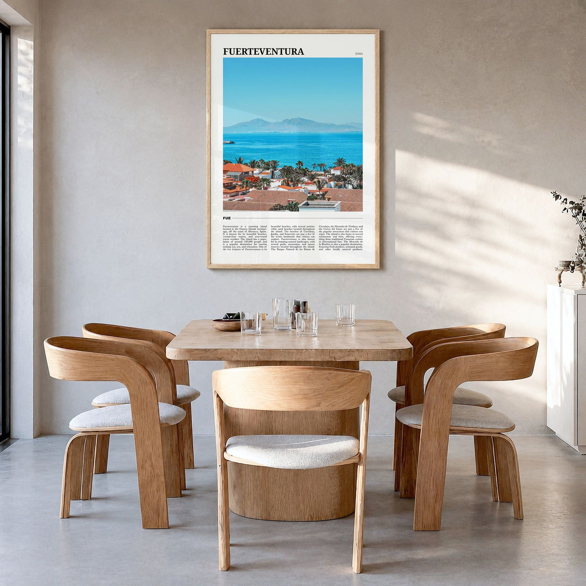 Fuerteventura Travel Poster in a natural wood frame, hanging in a dining room