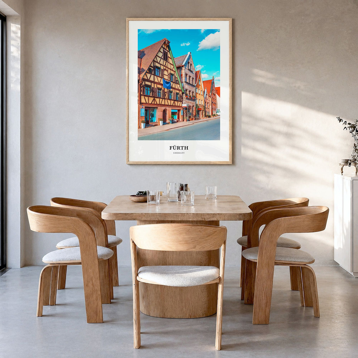 Fürth Classic Poster in a natural wood frame, hanging in a dining room