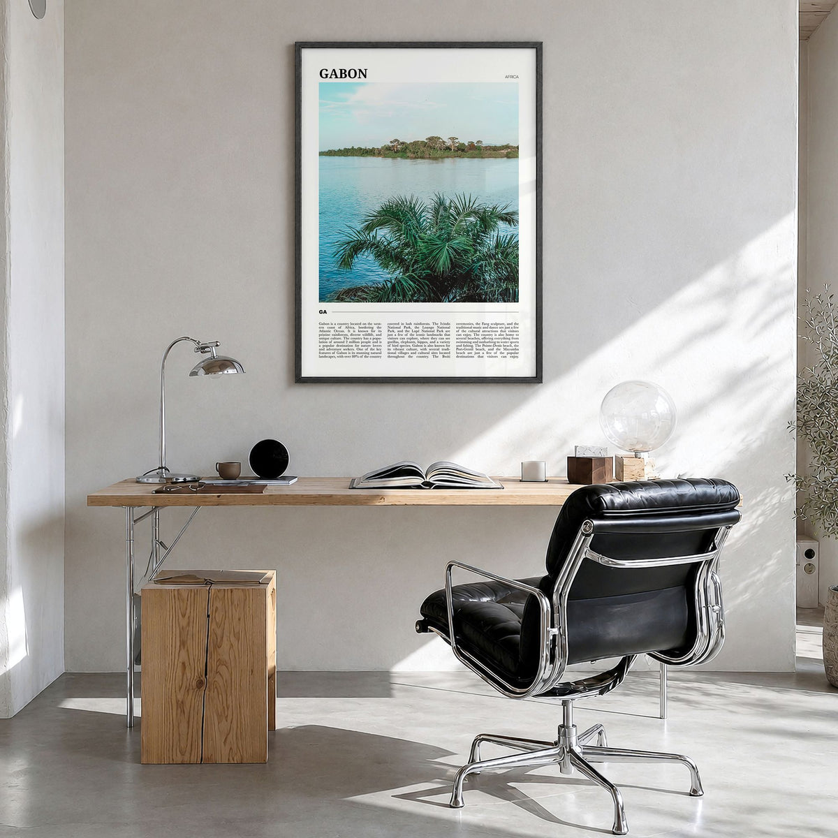 Gabon Travel Poster in a black wood frame, hanging in a bright home office