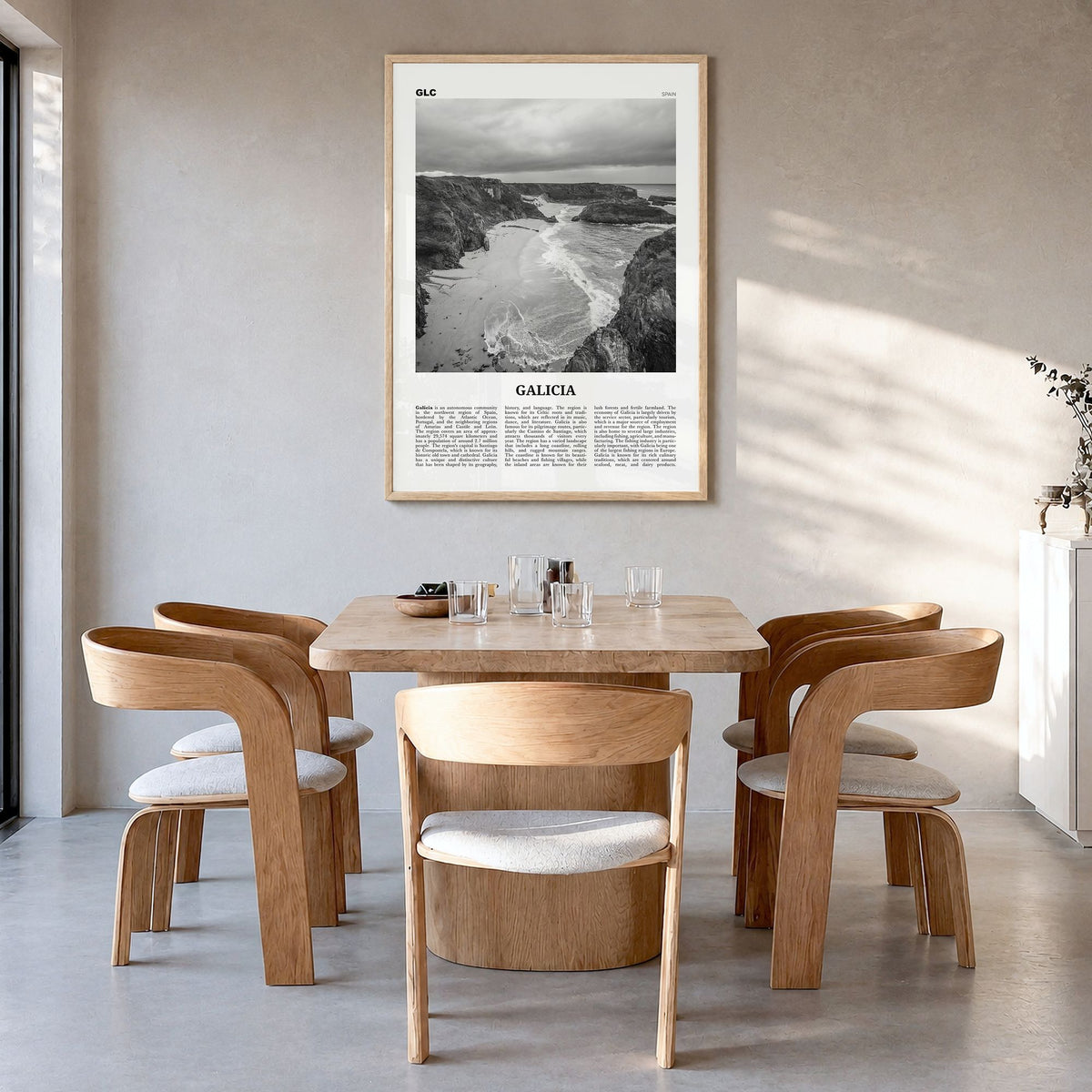 Galicia Newspaper Poster in a natural wood frame, hanging in a dining room