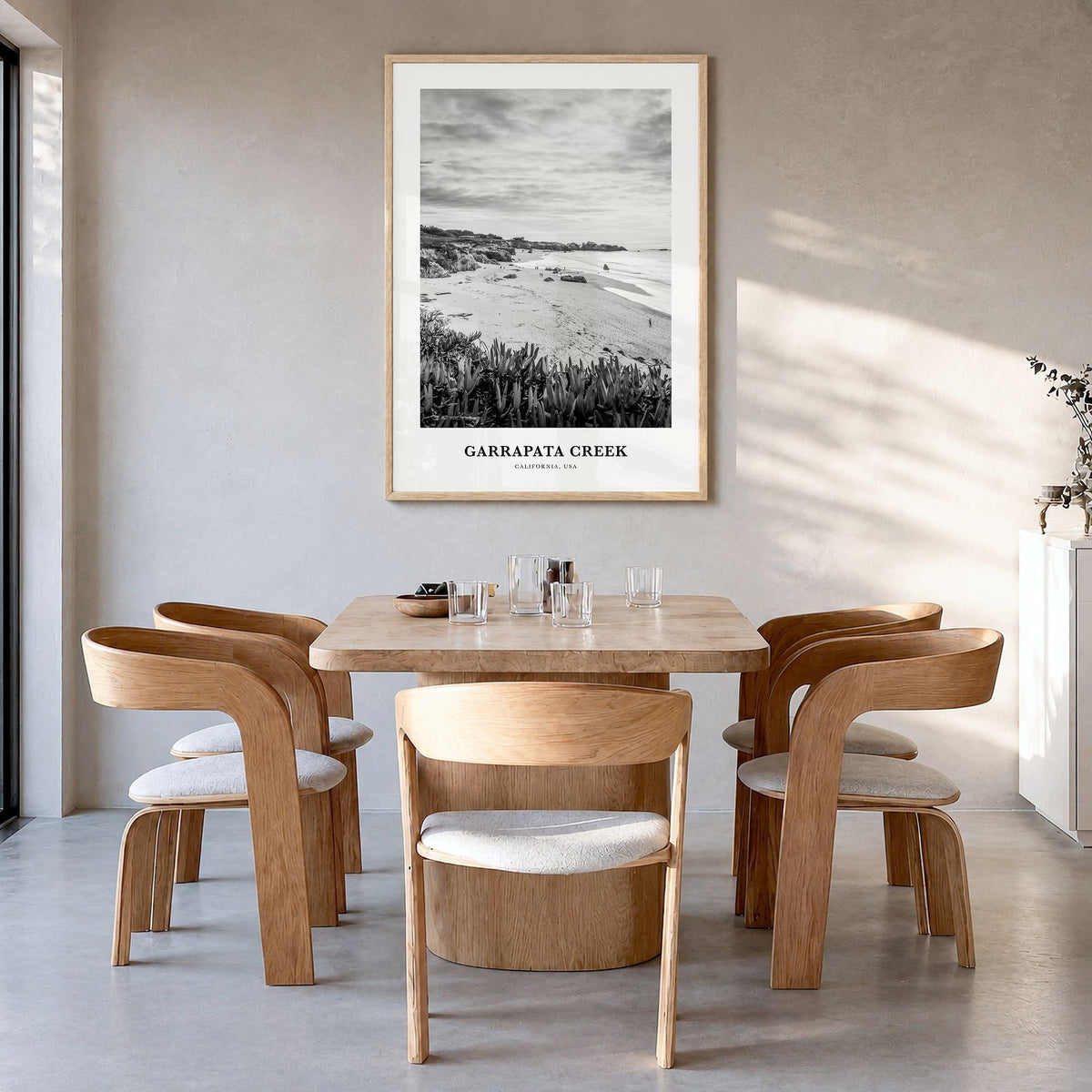 Garrapata Creek Classic Poster in a natural wood frame, hanging in a dining room
