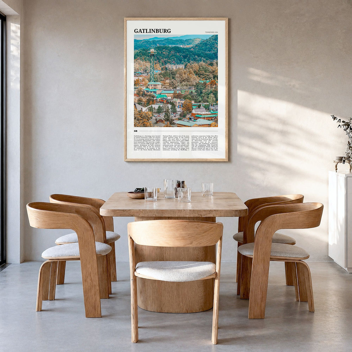 Gatlinburg Travel Poster in a natural wood frame, hanging in a dining room