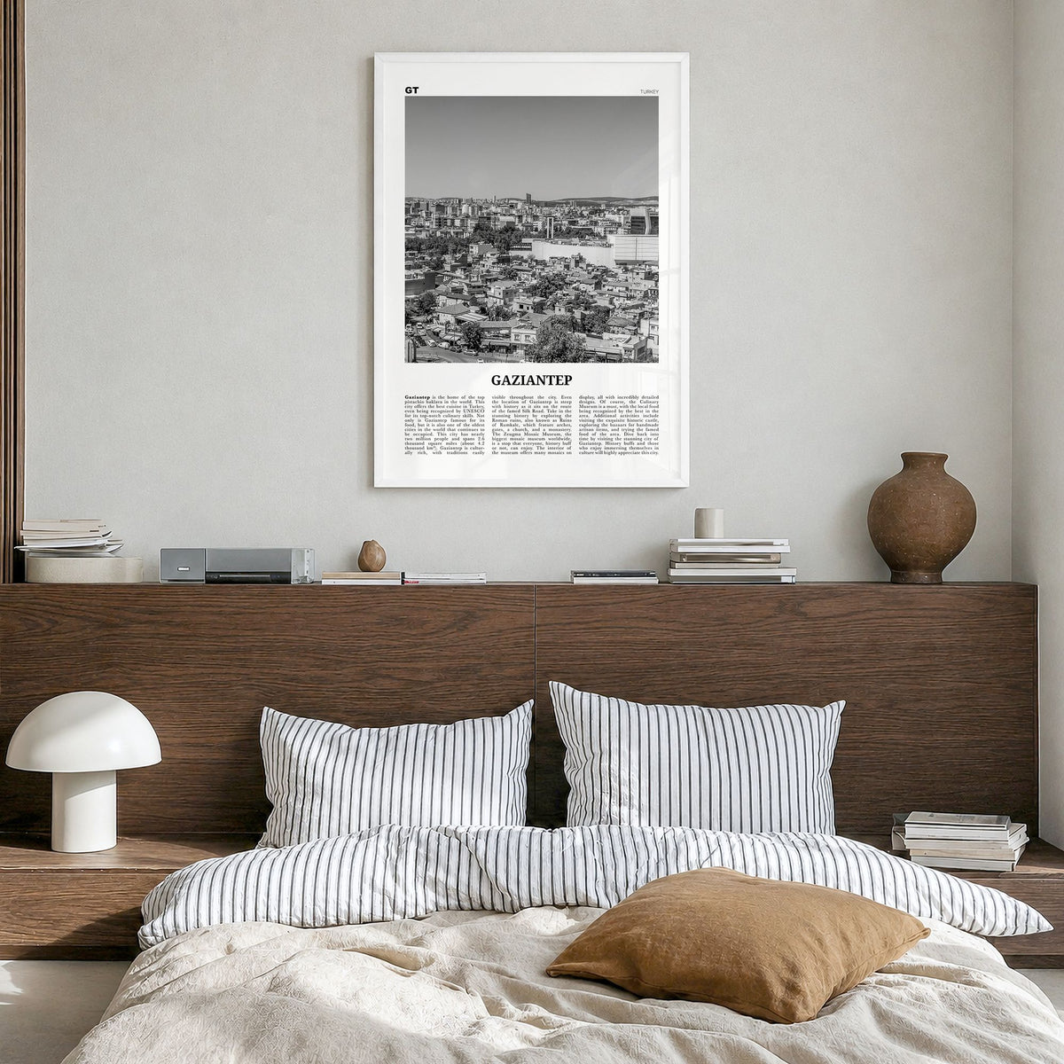 Gaziantep Newspaper Poster in a white wood frame, hanging in a bedroom