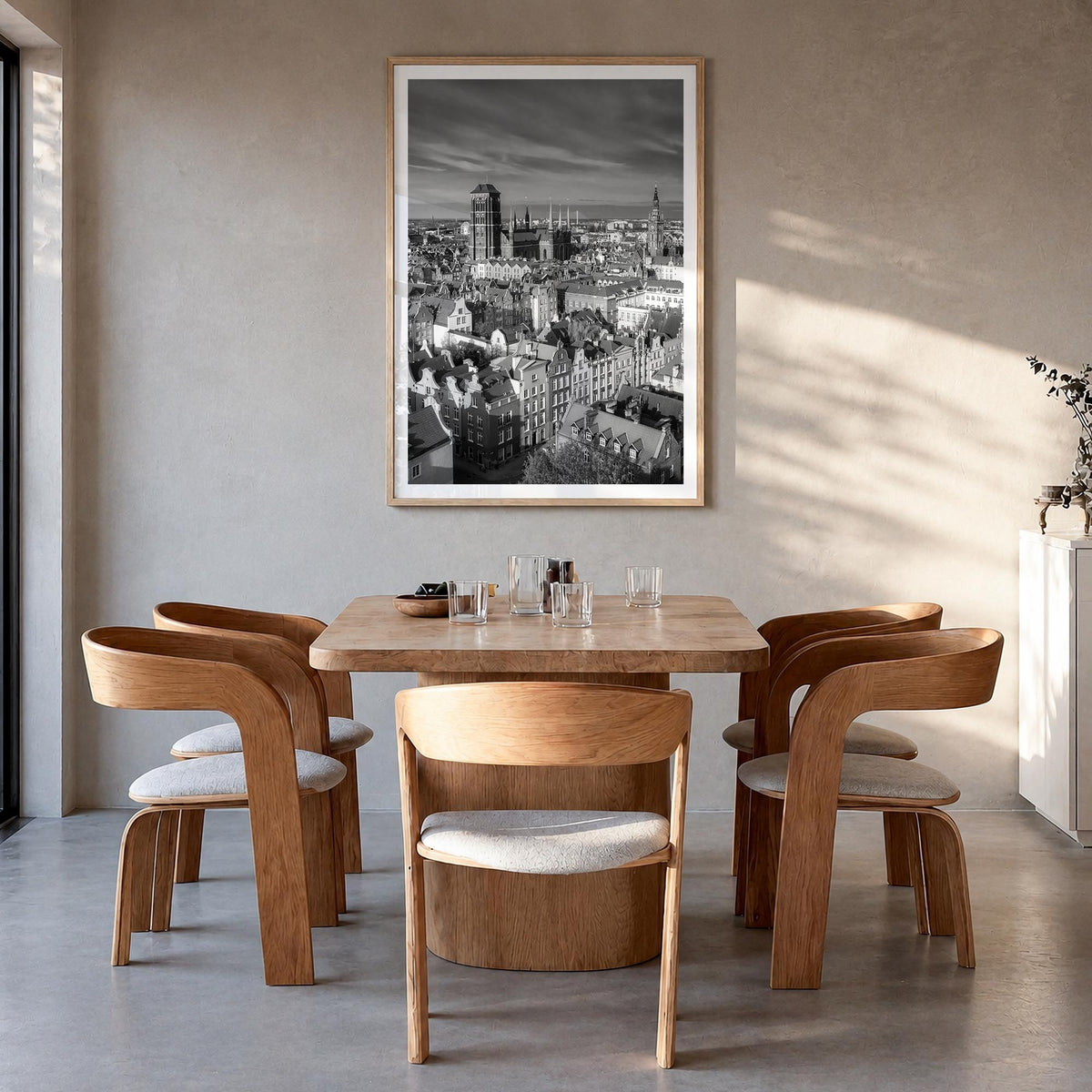 Gdańsk black & white photo poster of Poland – vertical wall art in natural wood frame with white border, hanging on wall