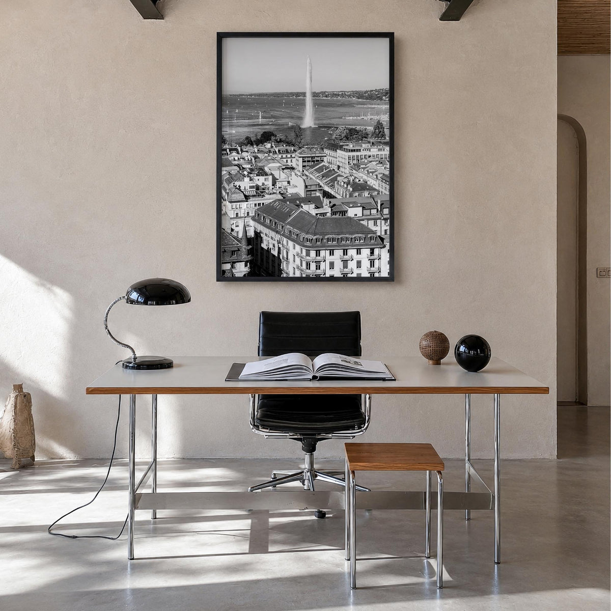 Geneva black & white photo poster of Switzerland – vertical wall art in black wood frame, hanging on wall