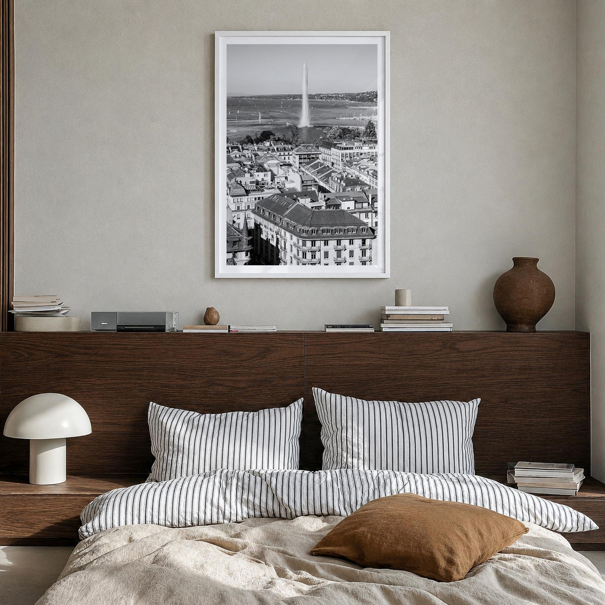 Geneva black & white photo poster of Switzerland – vertical wall art in white wood frame with white border, hanging on wall