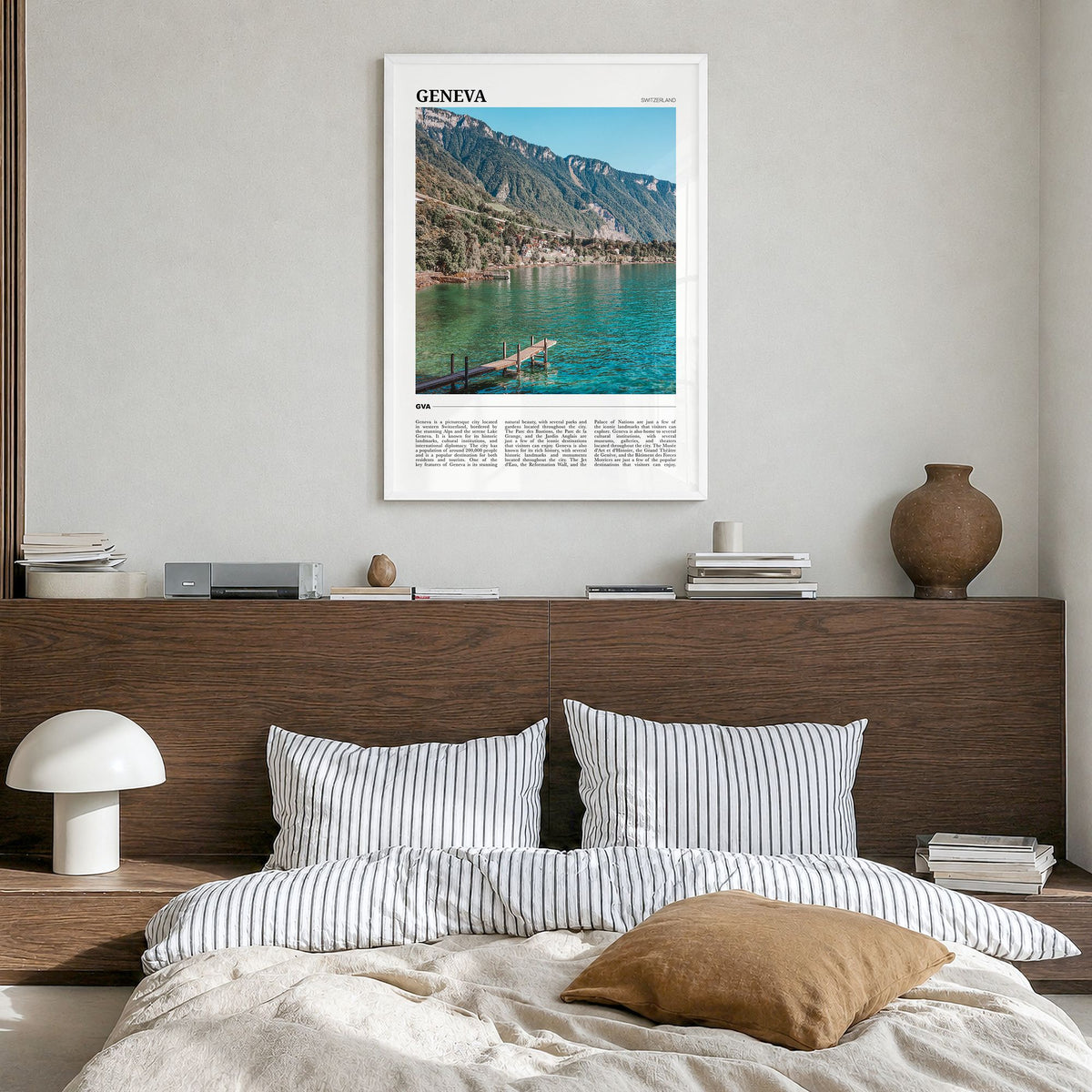 Geneva Travel Poster in a white wood frame, hanging in a bedroom