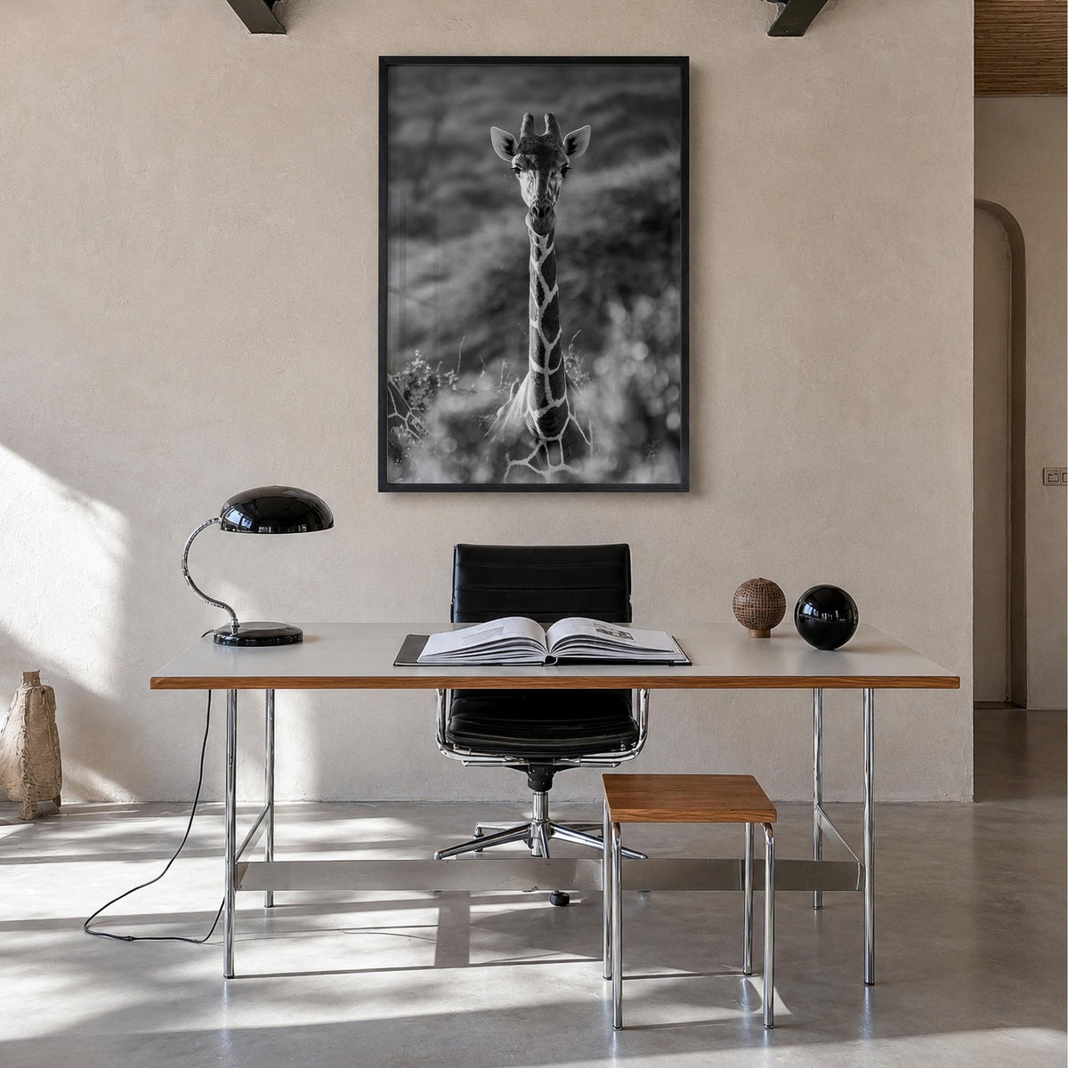 Giraffe no. 1 black & white photo poster – vertical wall art in black wood frame, hanging on wall
