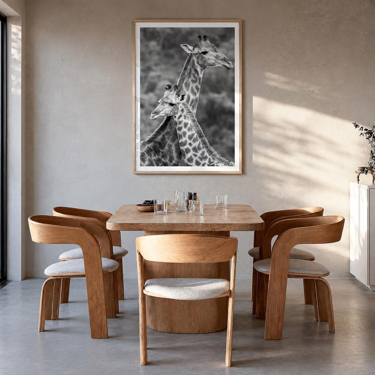 Giraffe no. 2 black & white photo poster – vertical wall art in natural wood frame with white border, hanging on wall