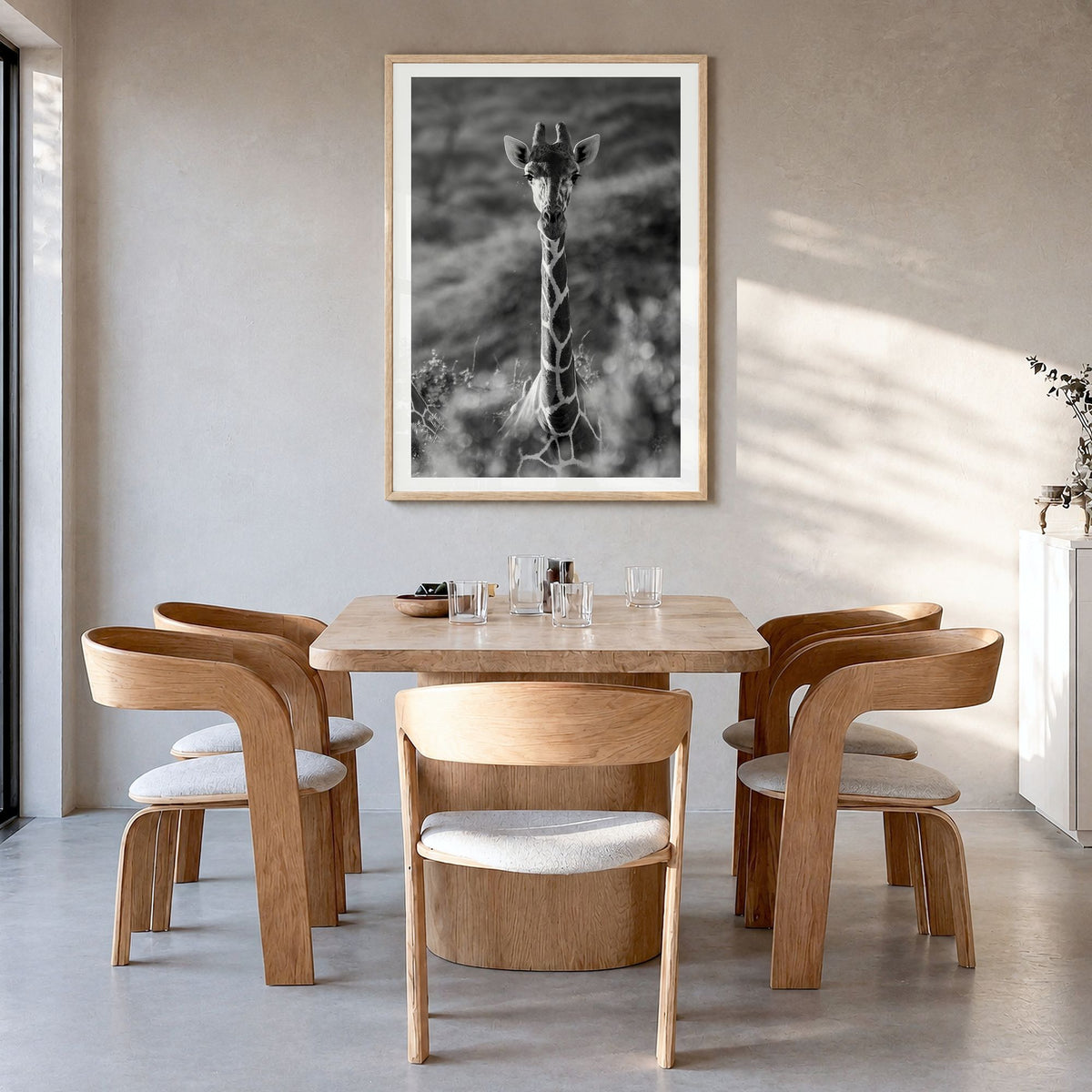 Giraffe Photo No 1 Poster in a natural wood frame, hanging in a dining room, white border