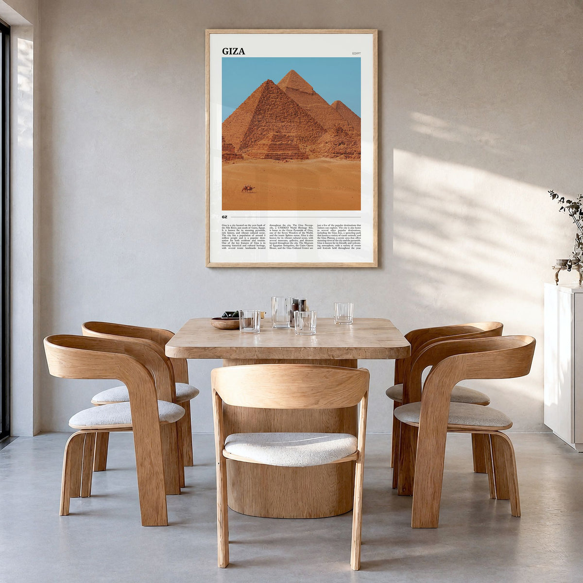 Giza Travel Poster in a natural wood frame, hanging in a dining room