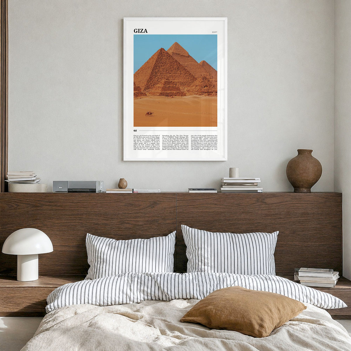 Giza Travel Poster in a white wood frame, hanging in a bedroom