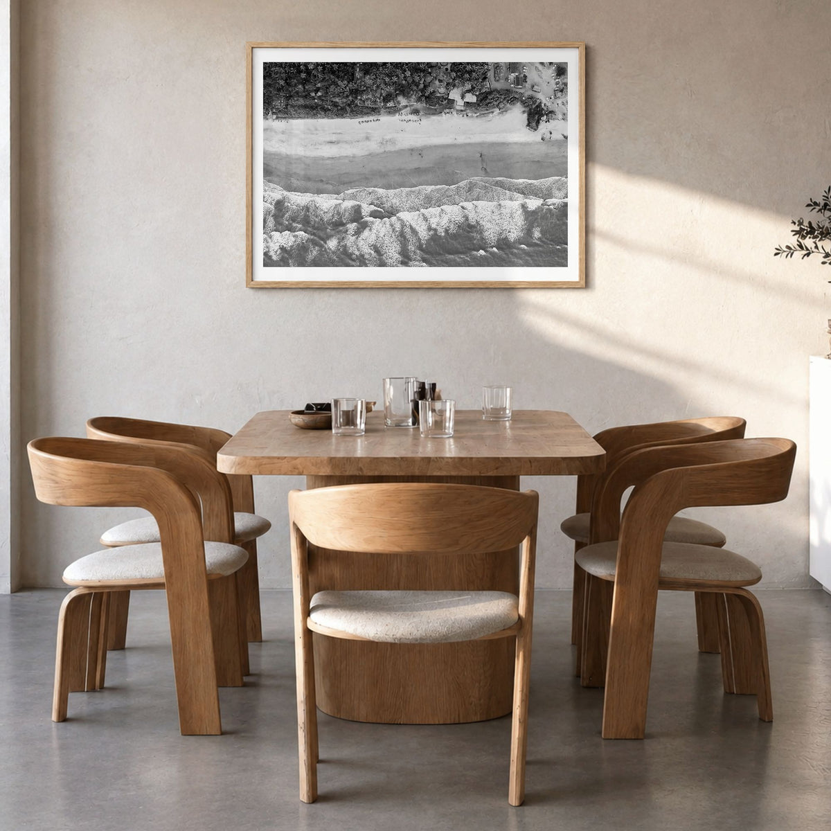Goa Photo Poster in a natural wood frame, hanging in a dining room, white border