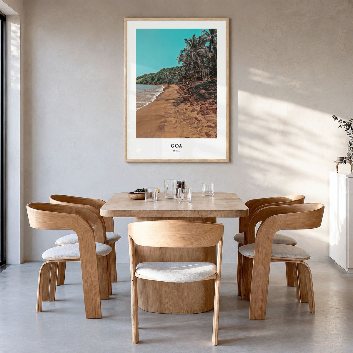 Goa Classic Poster in a natural wood frame, hanging in a dining room