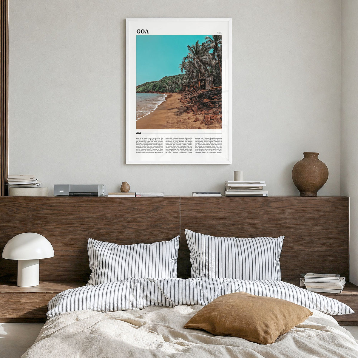 Goa Travel Poster in a white wood frame, hanging in a bedroom