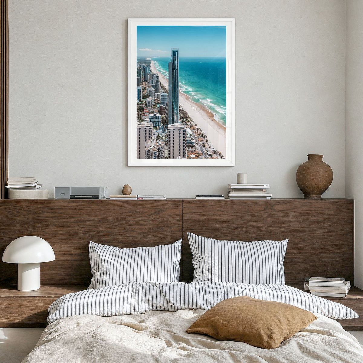 Gold Coast Photo Poster in a white wood frame, hanging in a bedroom, white border
