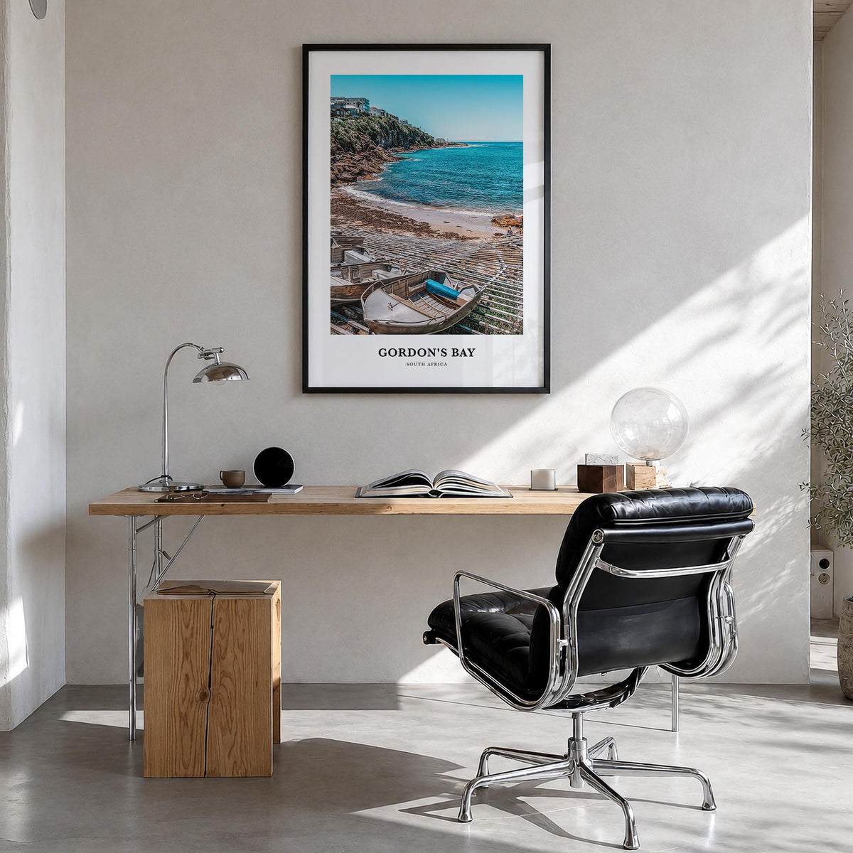 Gordon's Bay colorful classic poster of South Africa – vertical wall art in black wood frame, hanging on wall