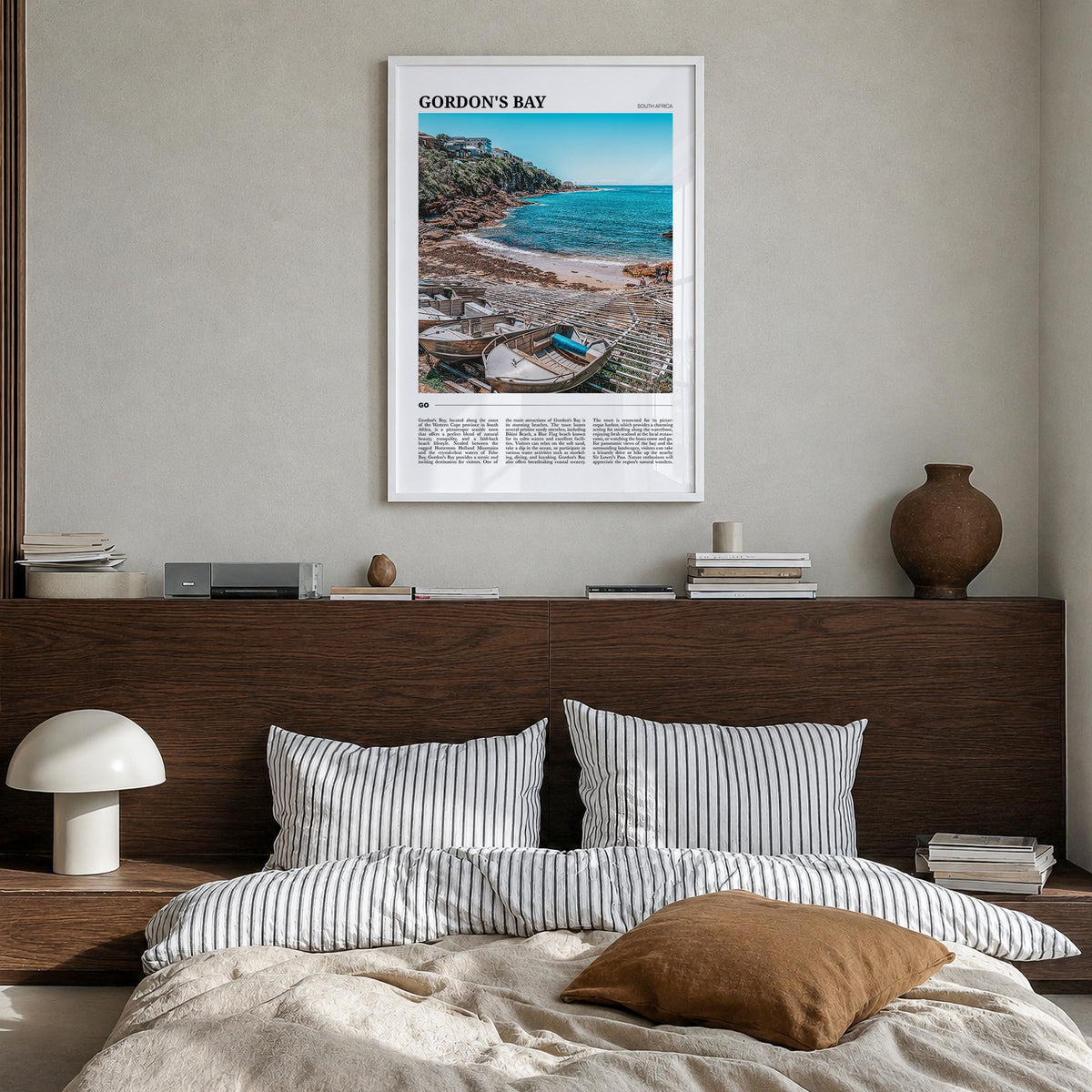 Gordon's Bay colorful travel poster of South Africa – vertical wall art in white wood frame, hanging on wall