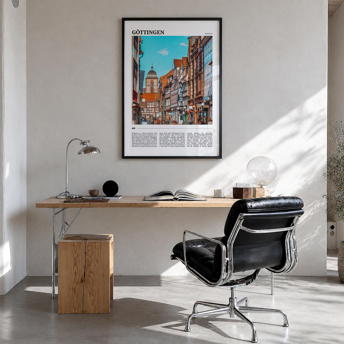 Göttingen colorful travel poster of Germany – vertical wall art in black wood frame, hanging on wall
