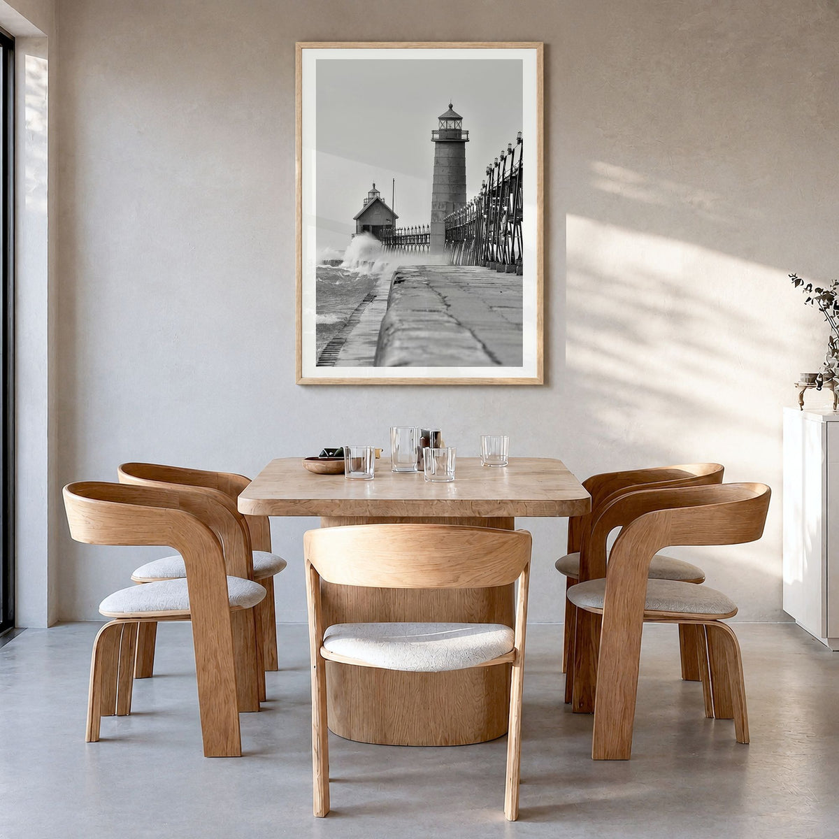 Grand Haven Photo Poster in a natural wood frame, hanging in a dining room, white border