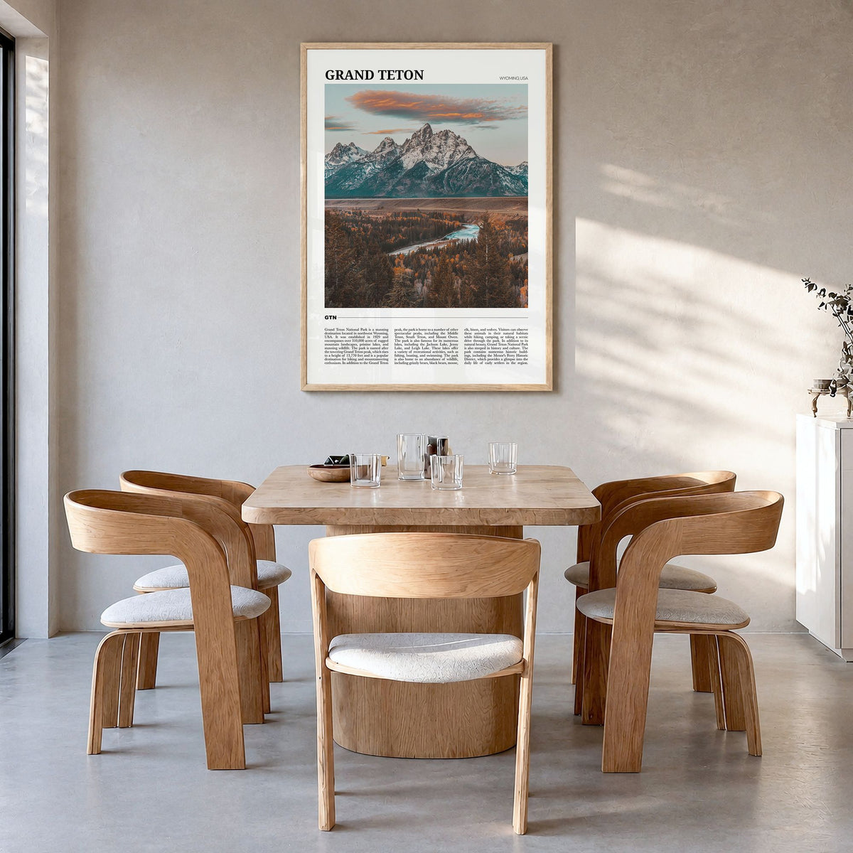 Grand Teton National Park Travel Poster in a natural wood frame, hanging in a dining room