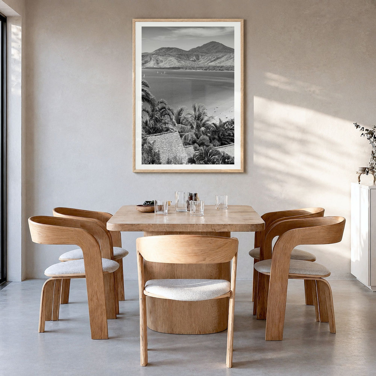Great Barrier Reef Photo Poster in a natural wood frame, hanging in a dining room, white border