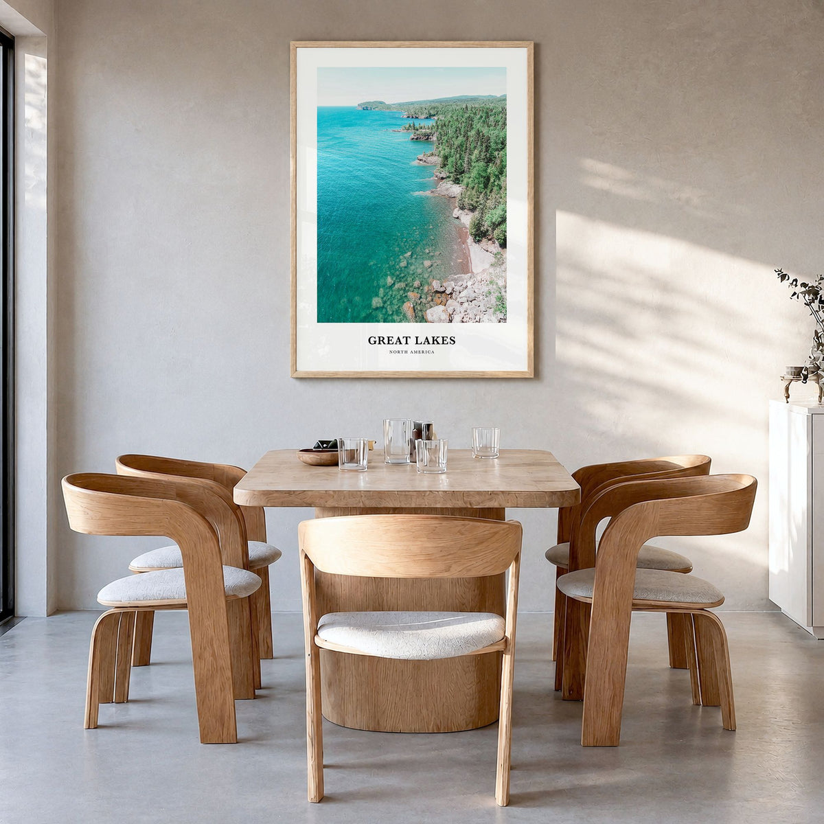 Great Lakes Classic Poster in a natural wood frame, hanging in a dining room