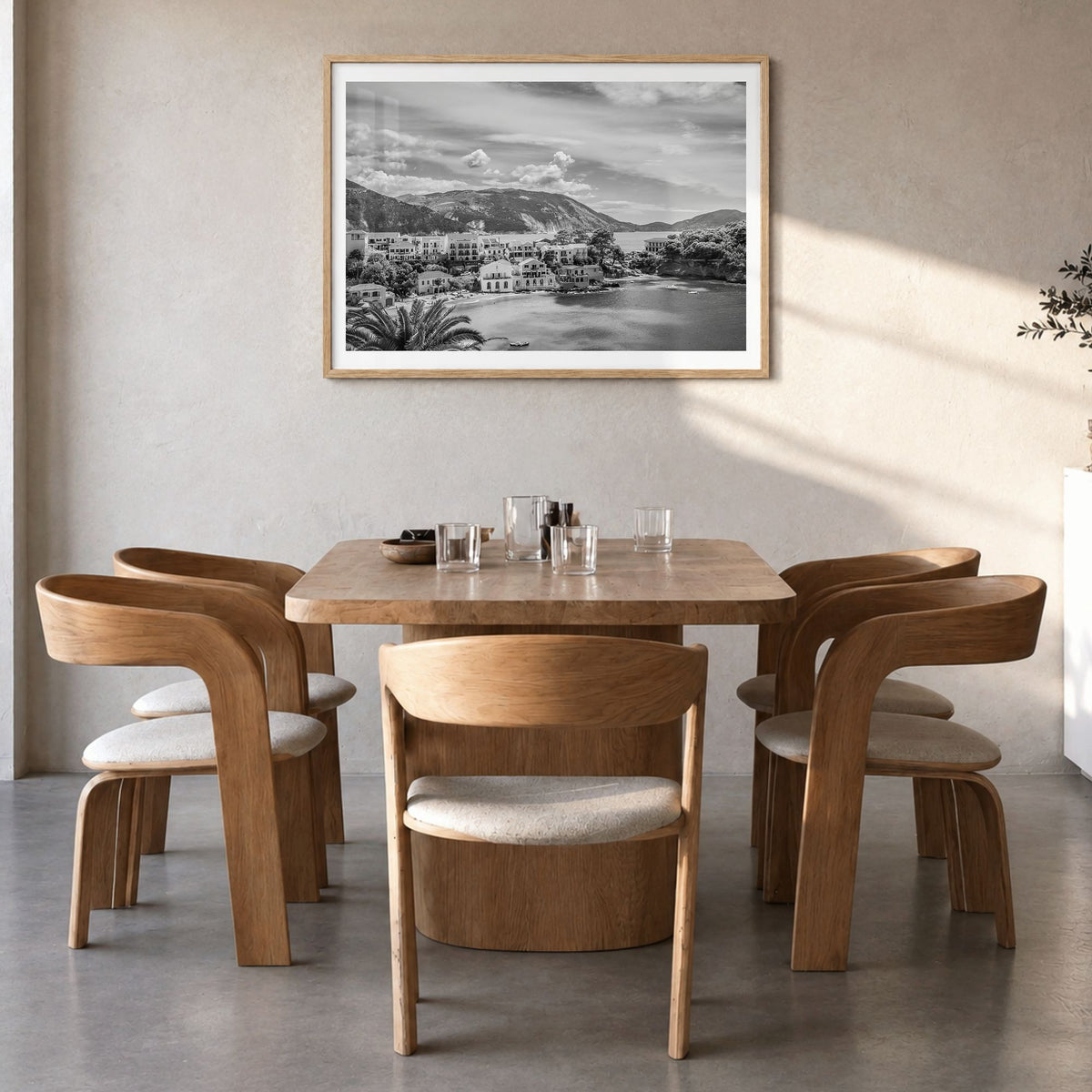 Greece Photo Poster in a natural wood frame, hanging in a dining room, white border