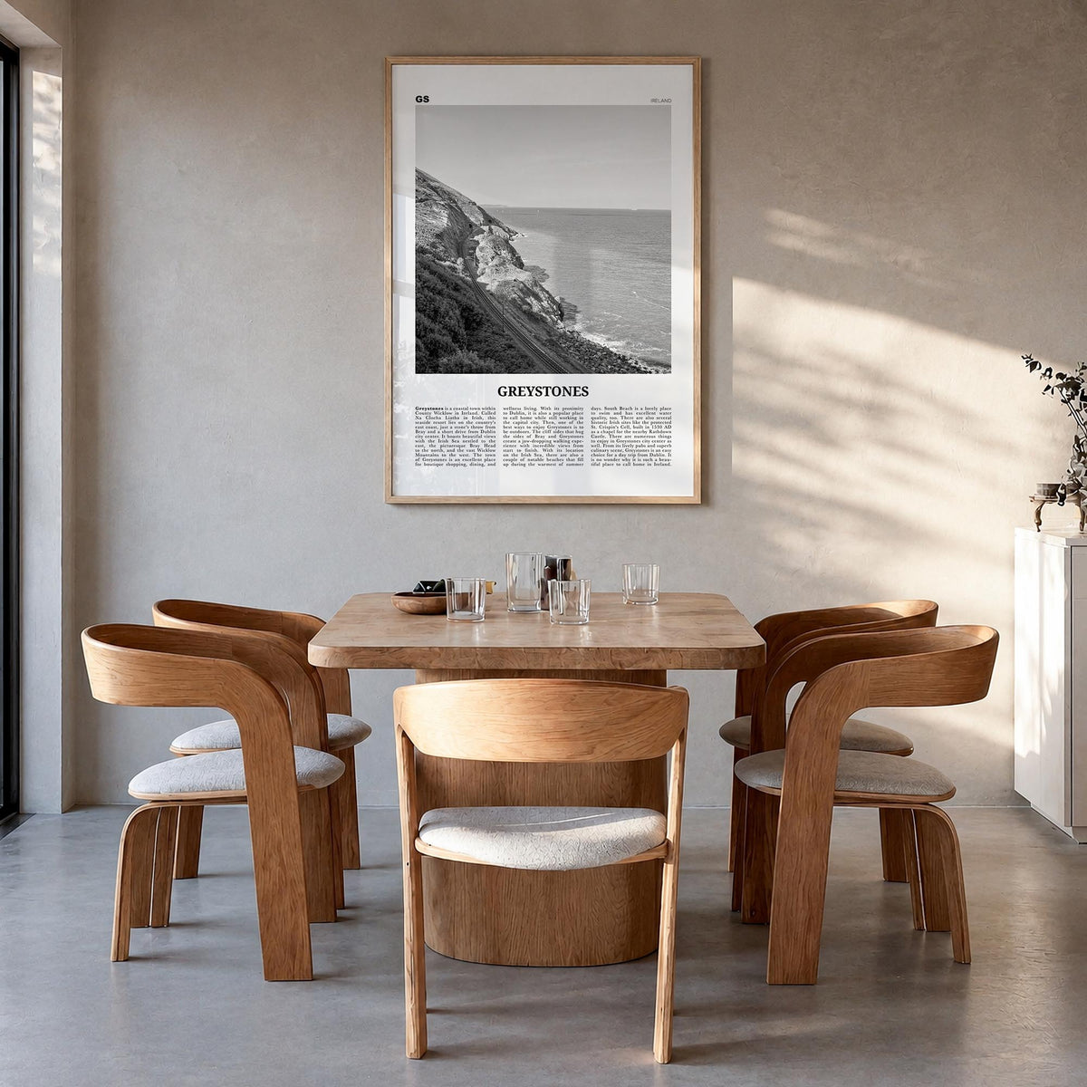 Greystones black & white newspaper poster of Ireland – vertical wall art in natural wood frame, hanging on wall