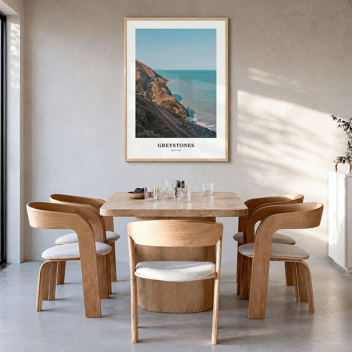 Greystones Classic Poster in a natural wood frame, hanging in a dining room