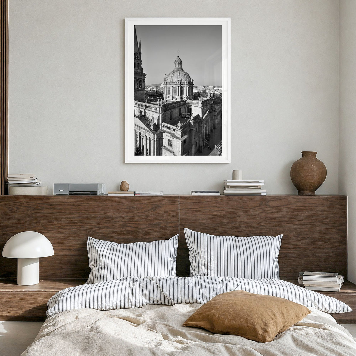 Guadalajara Photo Poster in a white wood frame, hanging in a bedroom, white border