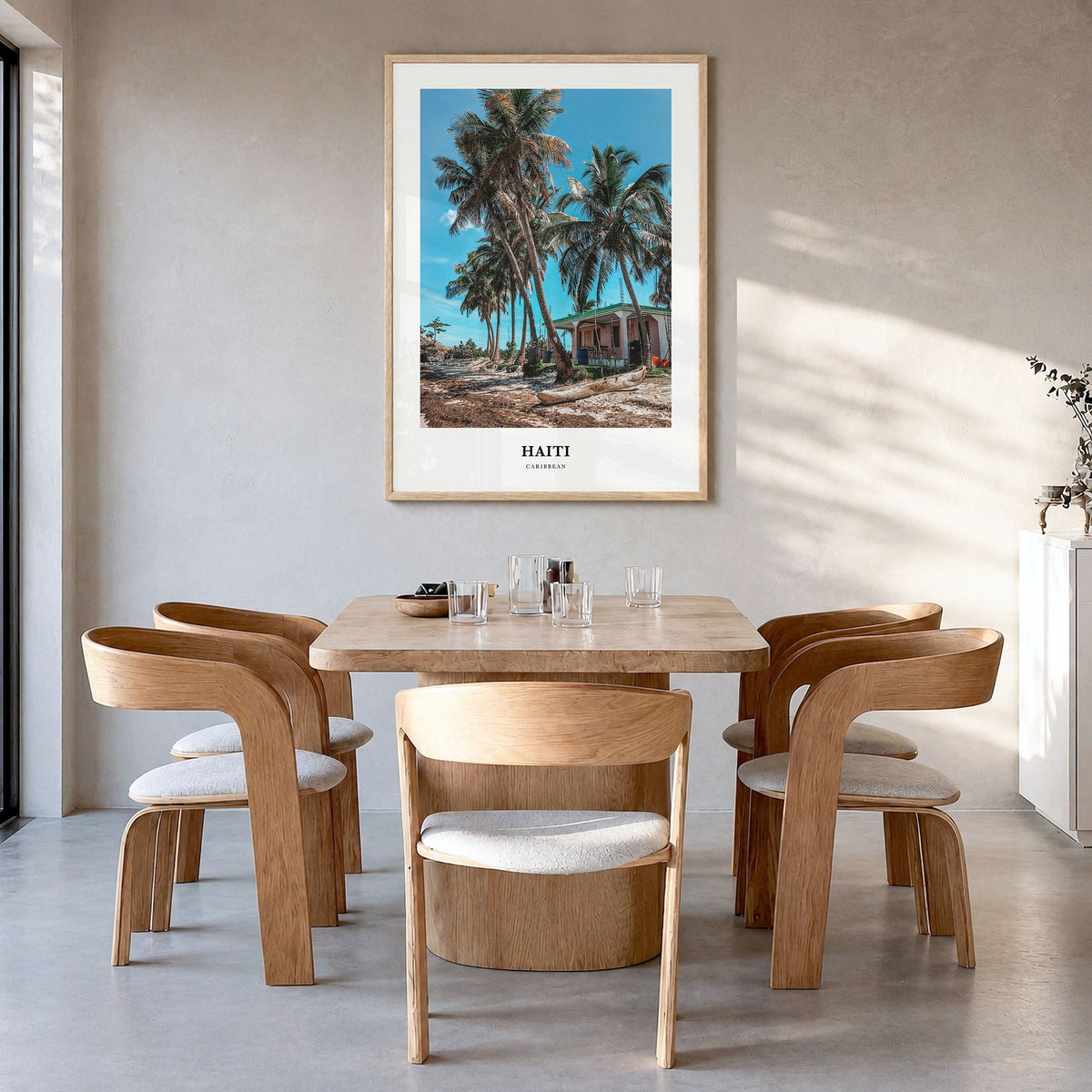 Haiti Classic Poster in a natural wood frame, hanging in a dining room