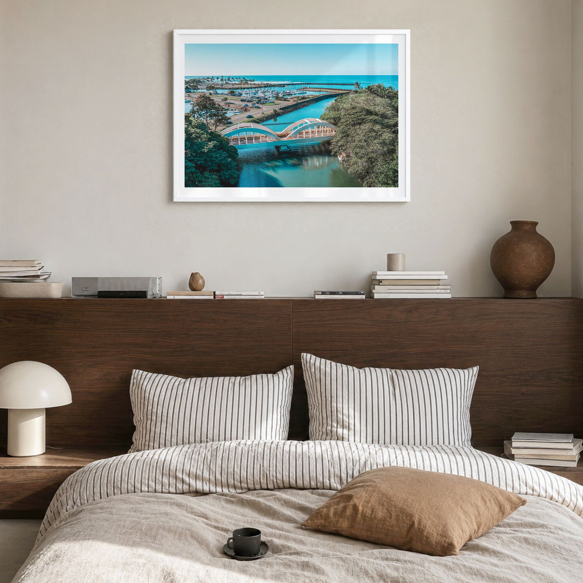 Haleiwa Photo Poster in a white wood frame, hanging in a bedroom, white border