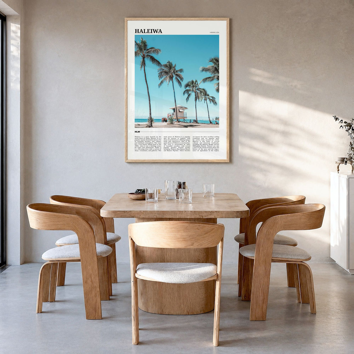 Haleiwa Travel Poster in a natural wood frame, hanging in a dining room