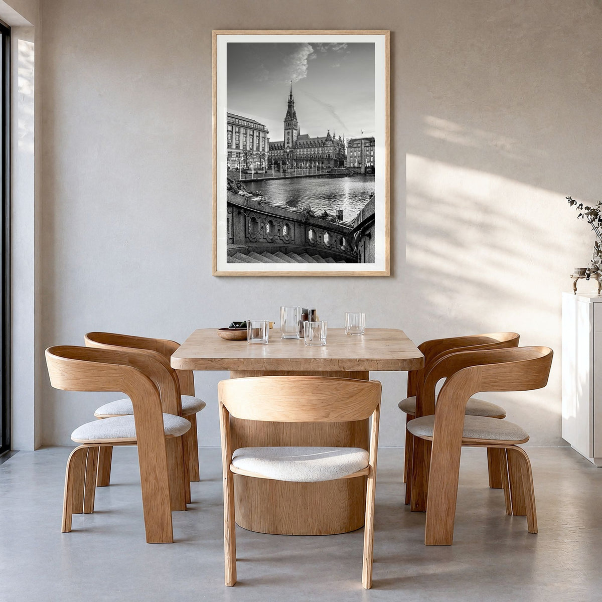 Hamburg Photo Poster in a natural wood frame, hanging in a dining room, white border