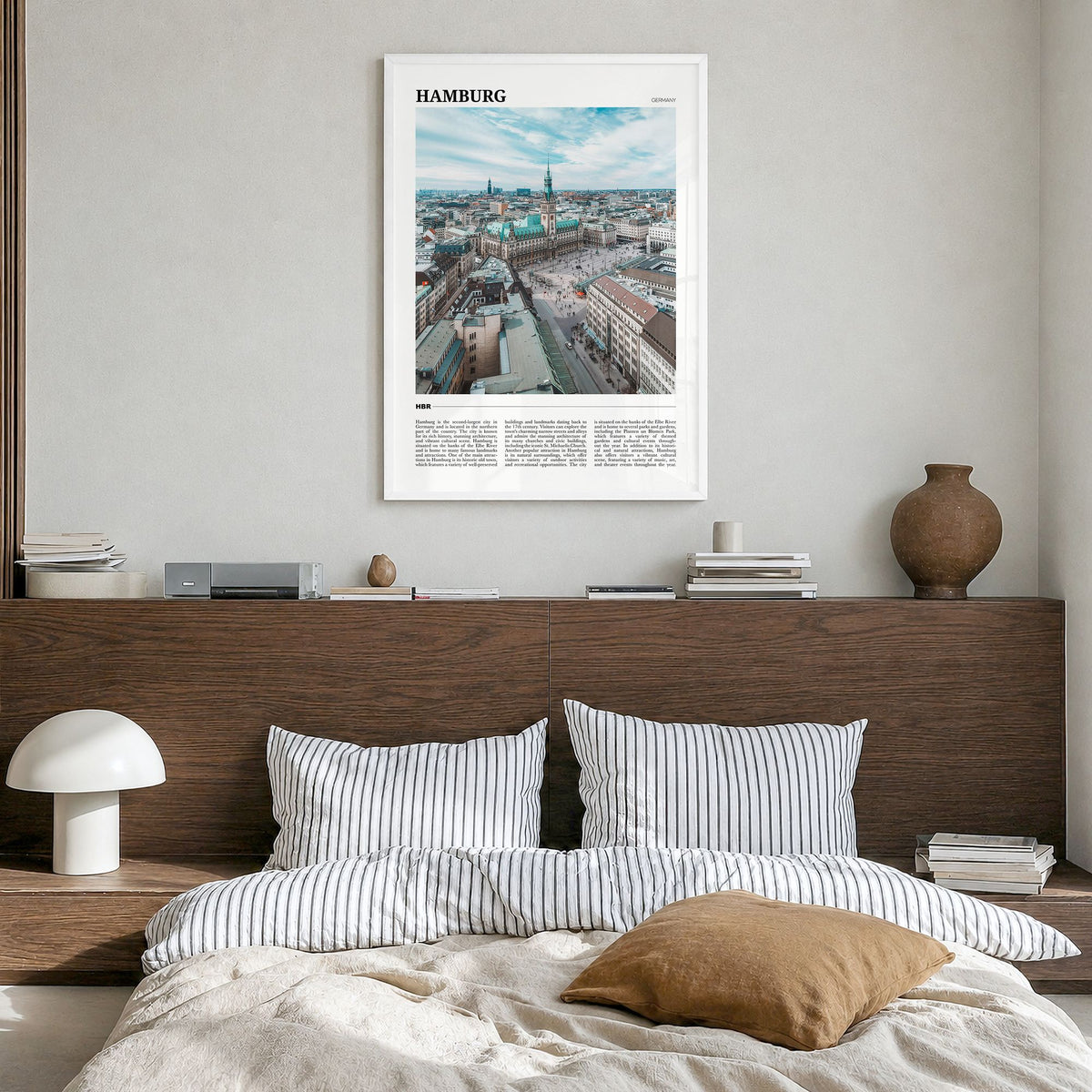 Hamburg Travel Poster in a white wood frame, hanging in a bedroom