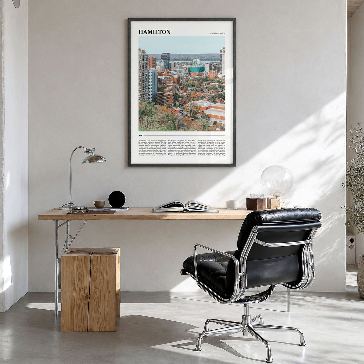 Hamilton, Canada Travel Poster in a black wood frame, hanging in a bright home office