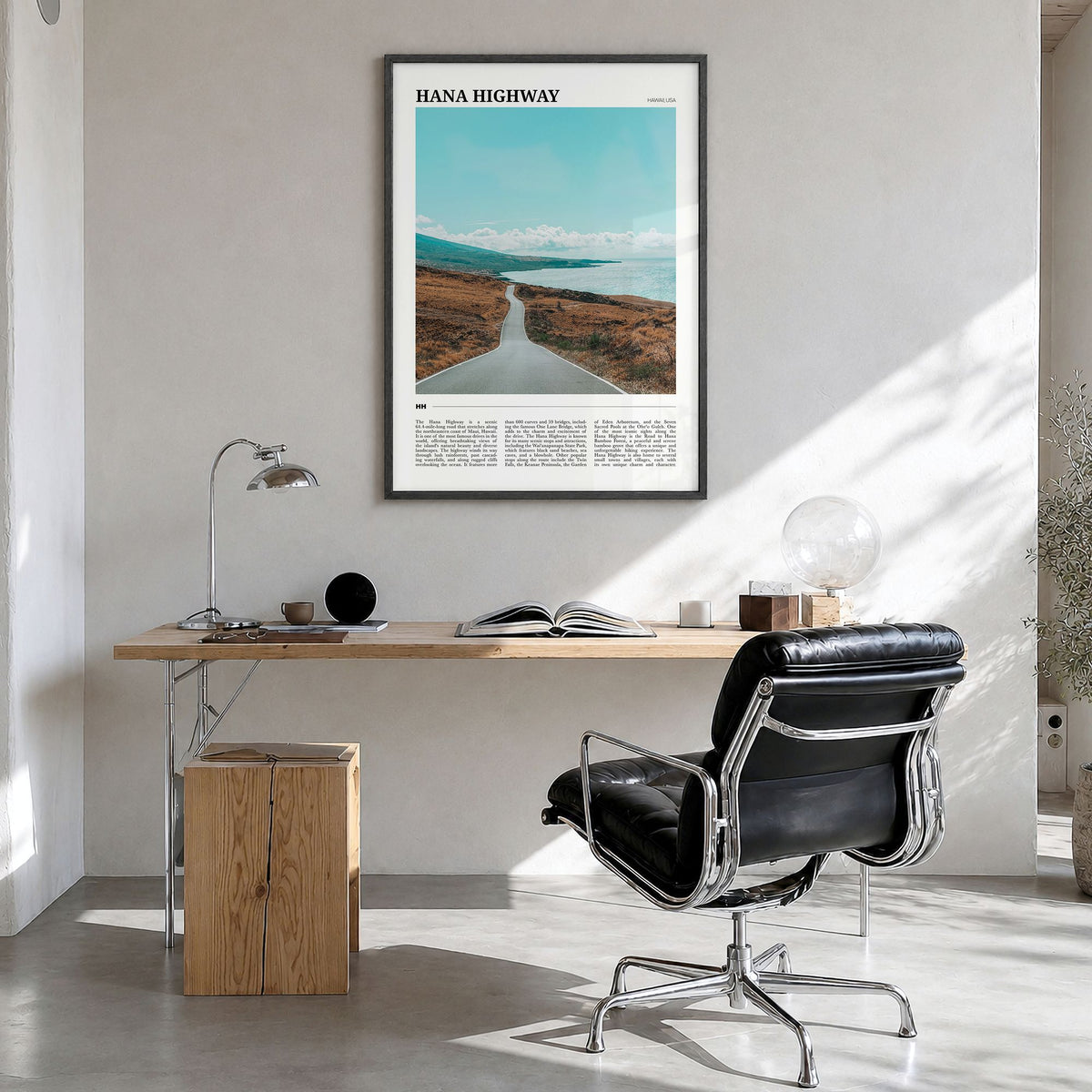 Hana Highway Travel Poster in a black wood frame, hanging in a bright home office