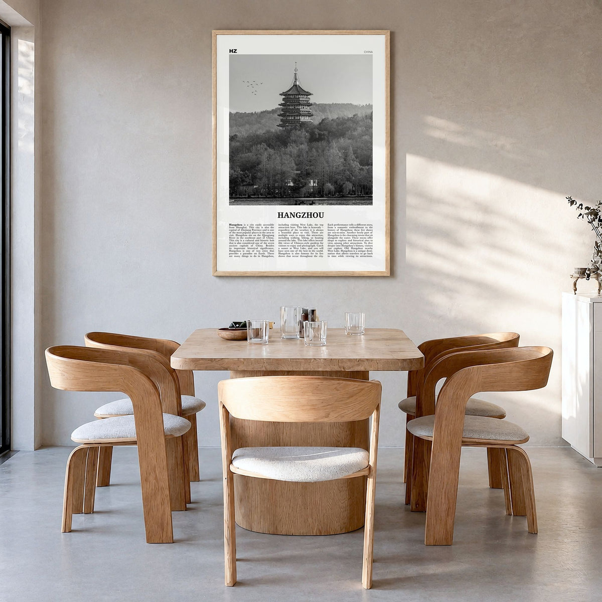 Hangzhou Newspaper Poster in a natural wood frame, hanging in a dining room